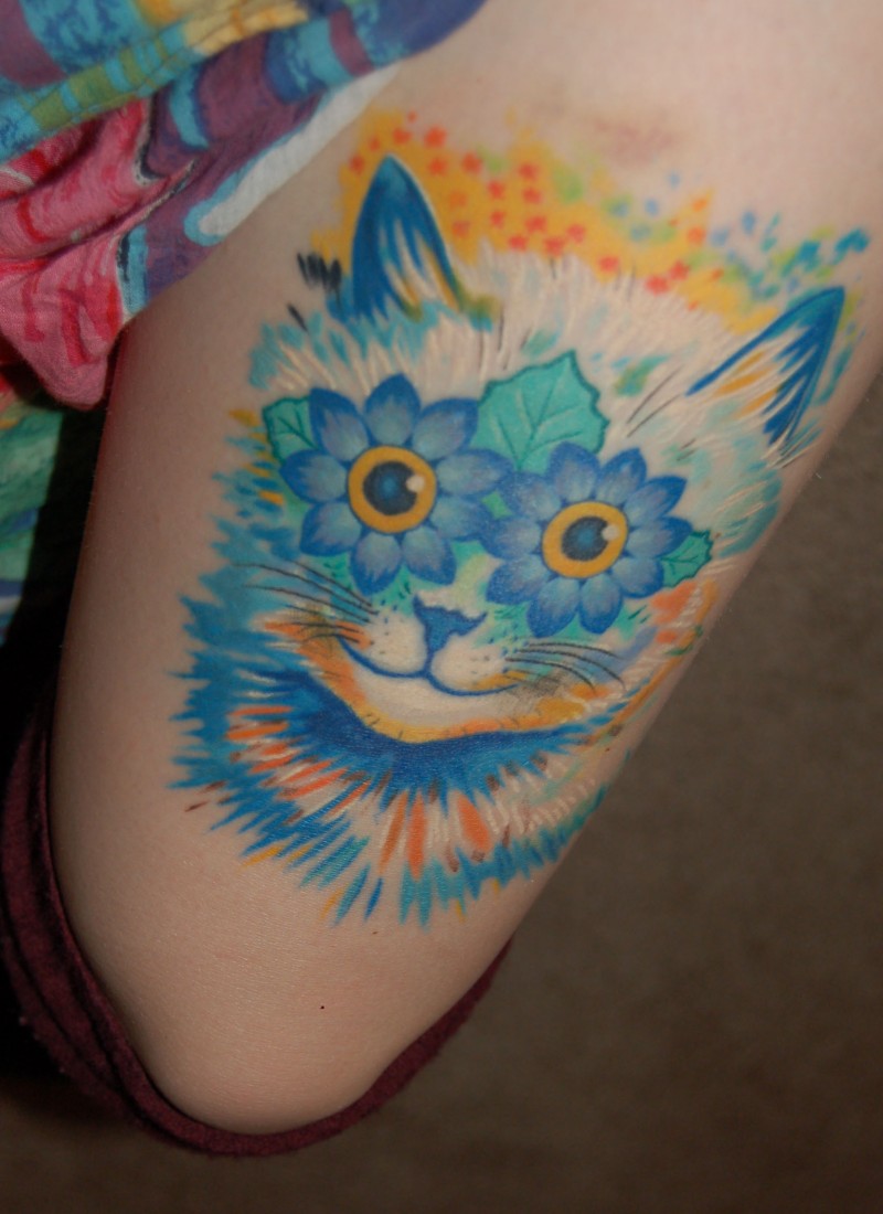 Marvelous bright colored cat with flowers eyes designed thigh tattoo