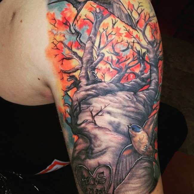 Marvelous colored big lonely tree tattoo on shoulder with lettering and birds