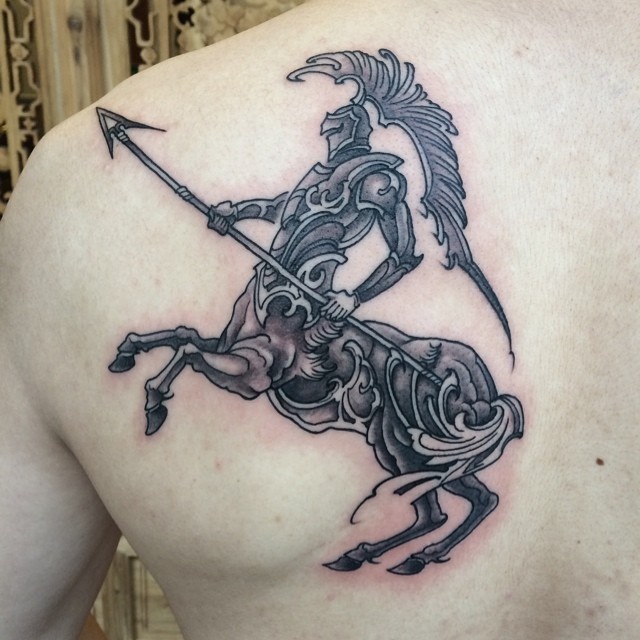 Marvelous looking black and white back tattoo of Centaurus in fantasy armor