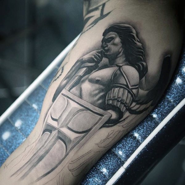 Marvelous looking black ink biceps tattoo of angel warrior statue