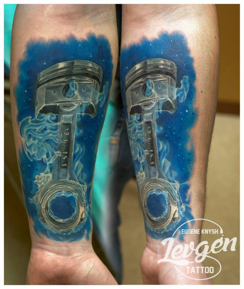 Marvelous multicolored forearm tattoo of very detailed car piston