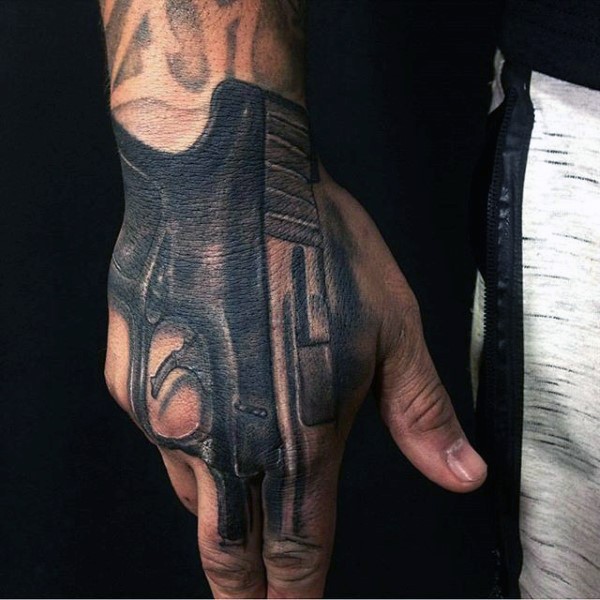 Marvelous realism style hand tattoo of Glock 17 pistol