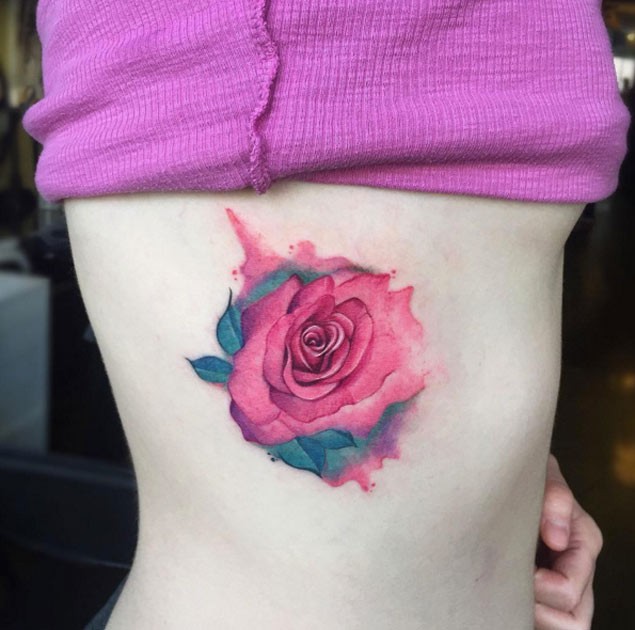 Marvelous red rose flower with paint drips side tattoo with watercolor elements