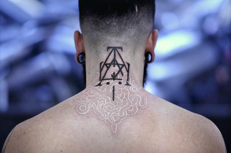 Marvelous white ink style upper back tattoo of snake combined with dark symbol