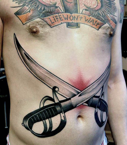 Massive 3D like colored crossed swords tattoo on belly