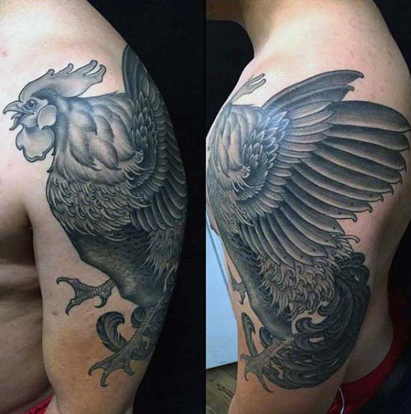 Massive black and white dancing cock tattoo on shoulder