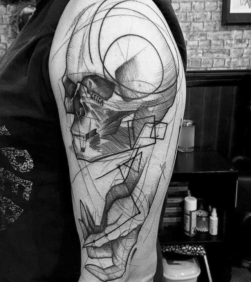 Massive black ink homemade shoulder tattoo of skull with arm sketch