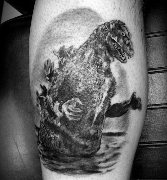 Massive cartoon like designed Godzilla tattoo on leg