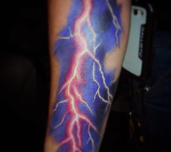 Massive colored lightning tattoo on arm