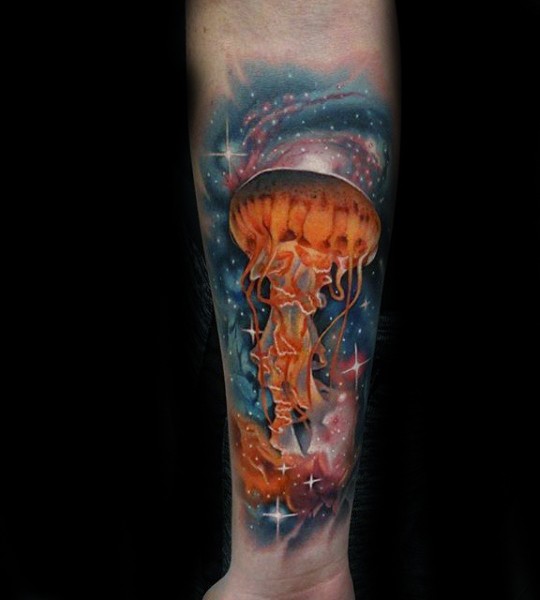 Massive colorful detailed jellyfish in space tattoo on arm
