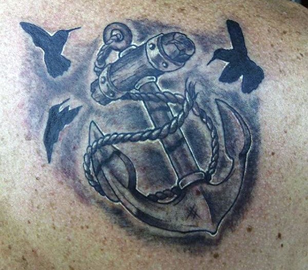 Massive detailed roped anchor and black birds tattoo