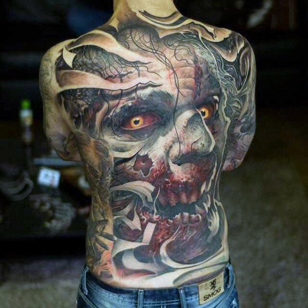 Massive glorious whole back tattoo of creepy monster face