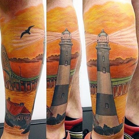 Massive gorgeous colored realistic looking lighthouse tattoo on leg