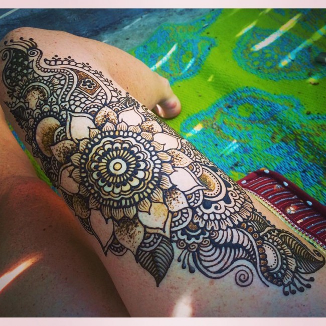 Massive Mehendy floral Henna style pattern tattoo on leg with impressive details