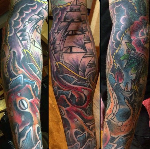 Massive multicolored nautical themed tattoo with octopus and ship tattoo on sleeve