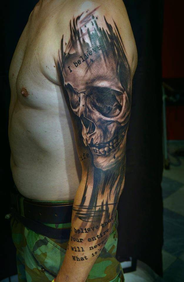 Massive multicolored sleeve tattoo of very detailed human skull and lettering