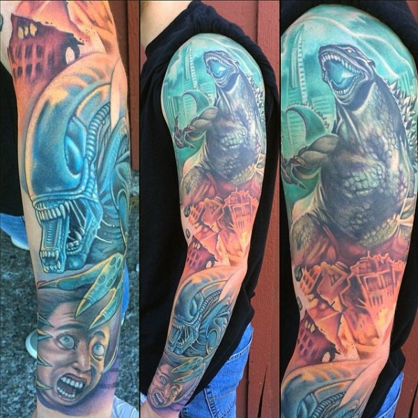 Massive multicolored various alien monsters tattoo on sleeve