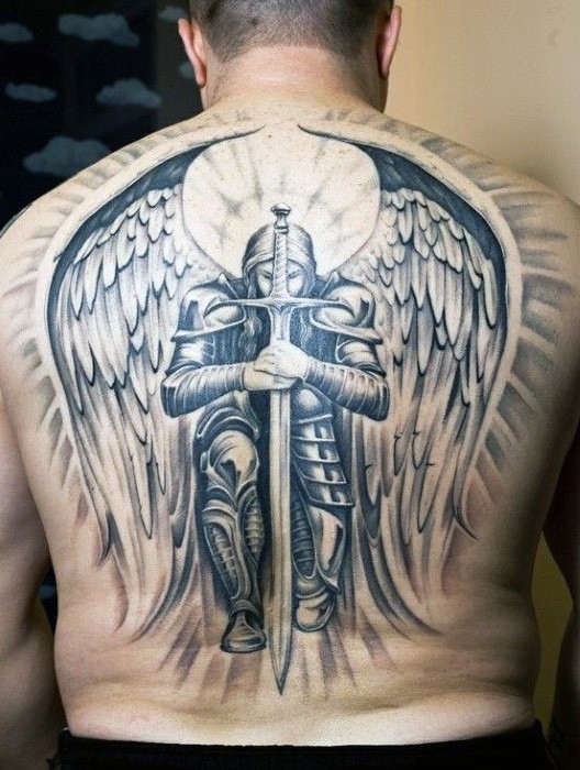 Massive multicolored very detailed whole back tattoo of hole angel warrior