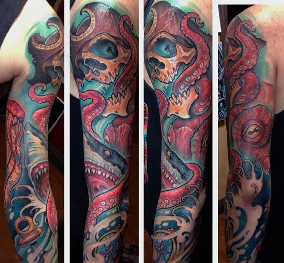 Massive natural colored underwater octopus with skull tattoo on sleeve