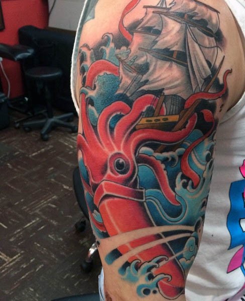 Massive red colored evil squid attacking the ship tattoo on half sleeve zone