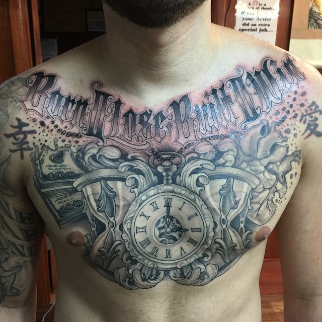 Massive various clocks with human hear and money tattoo on chest with lettering