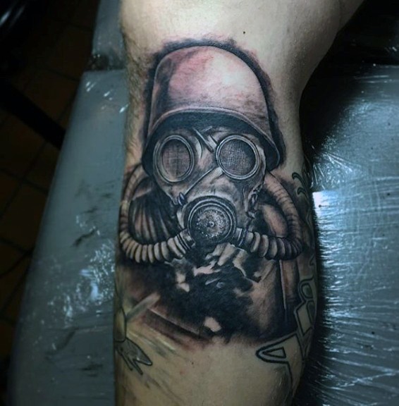 Medium size 3D style black ink soldier in gas mask tattoo on leg
