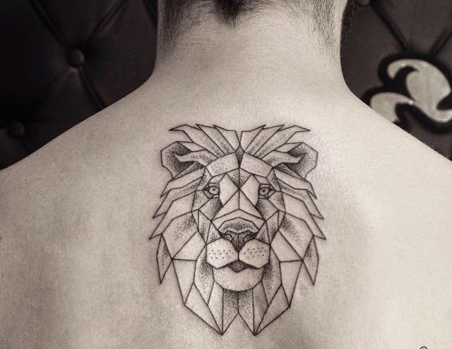 Medium size black and white lion&quots head tattoo on upper back in linework style
