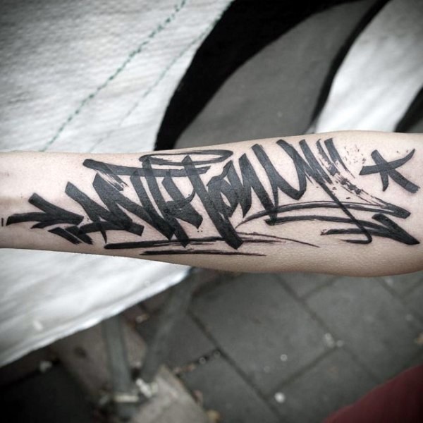 Medium size black ink arm tattoo of graffiti lettering
