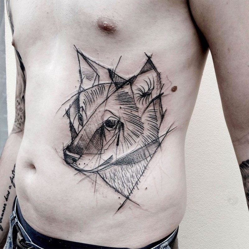 Medium size black ink side tattoo of fox head