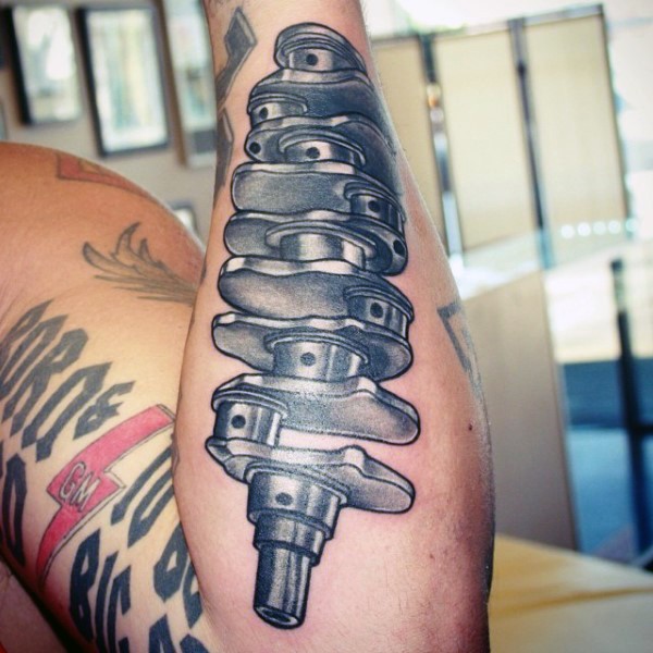 Medium size colored and detailed crankshaft tattoo on forearm