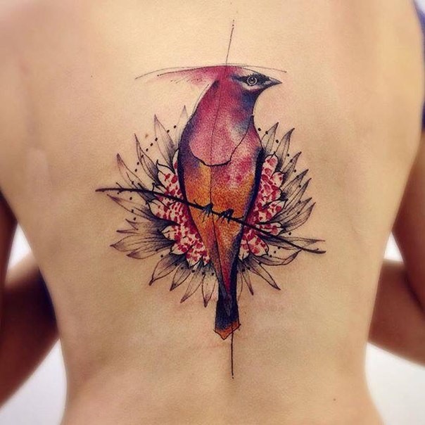 Medium size illustrative style bird tattoo with big flower