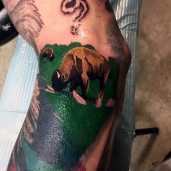 Medium size multicolored arm tattoo of grunting ox