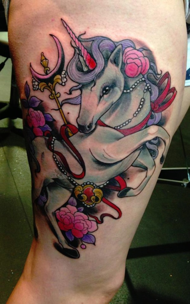 Medium size multicolored thigh tattoo of fantasy unicorn and flowers