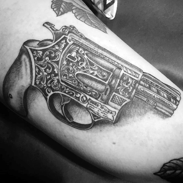 Medium sized black ink 3D style beautiful lady pistol tattoo