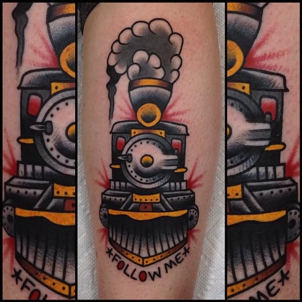 Memorial colored leg tattoo of steamy train with lettering