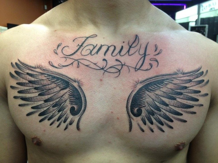 Memorial like massive black ink wings with Family word tattoo on chest
