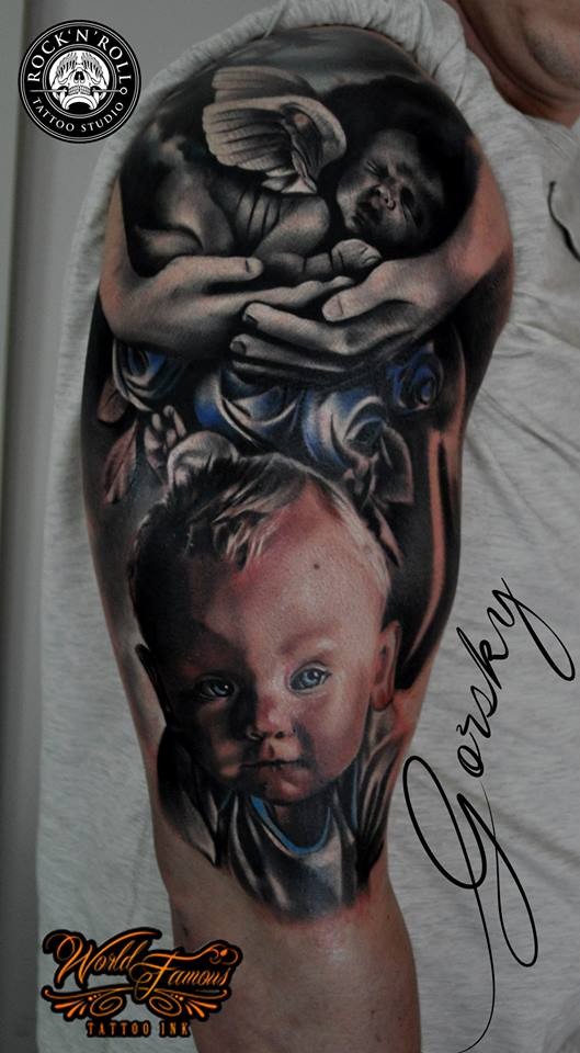memorial style colored shoulder tattoo of little baby with angel