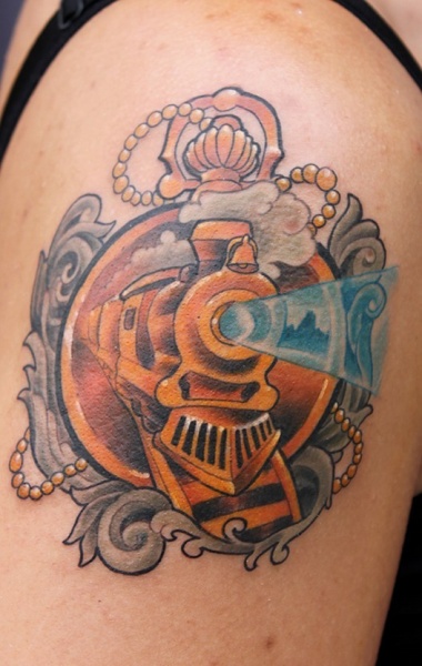 Memorial style colored shoulder tattoo of golden train with clock