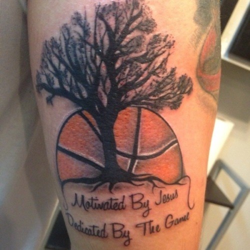 Memorial style colored thigh tattoo of lonely tree with basketball and lettering