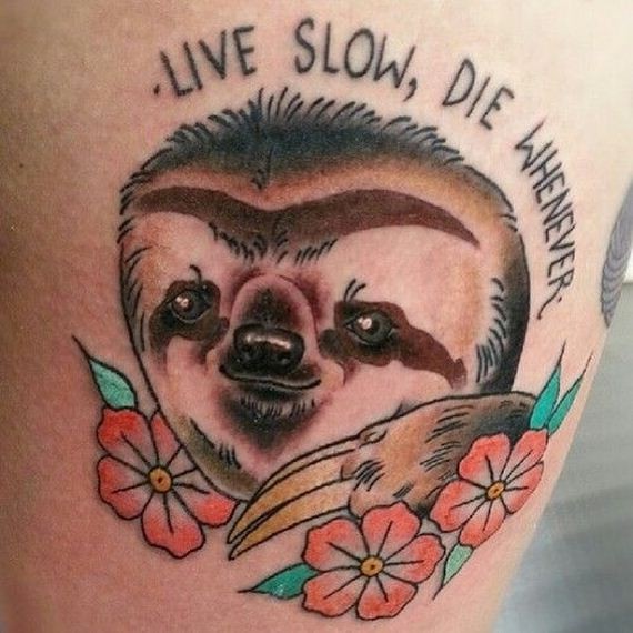 Memorial style painted nice sloth with flowers and lettering tattoo on thigh