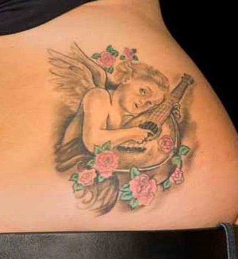 Merry cherub playing a mandolin tattoo on lower back