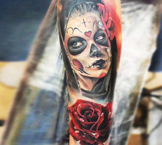 Mexican style colored arm tattoo of Woman with rose