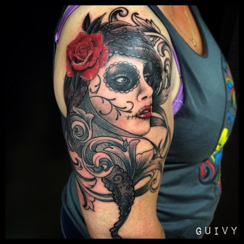 Mexican style colored shoulder tattoo of woman portrait stylized with red rose