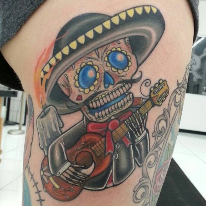 Mexican sugar skeleton plays guitar tattoo