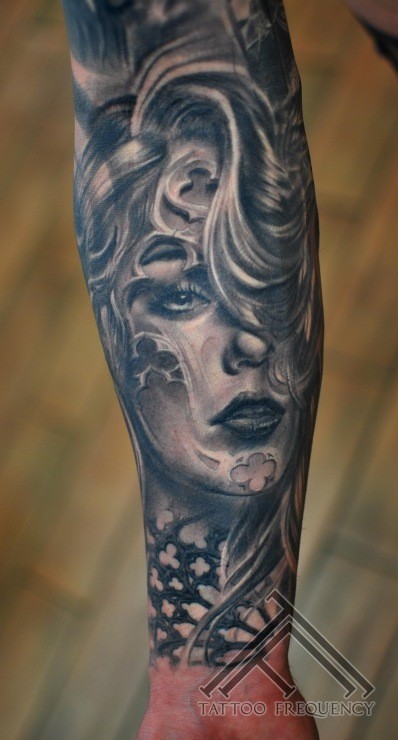 Mexican traditional black and white forearm tattoo of woman portrait
