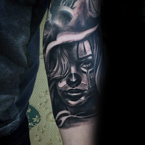Mexican traditional colored forearm tattoo of woman face in fog