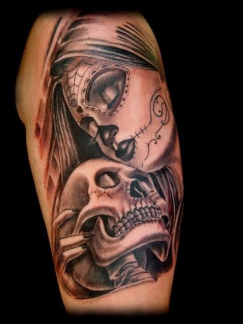 Mexican traditional colored shoulder tattoo of woman with skeleton