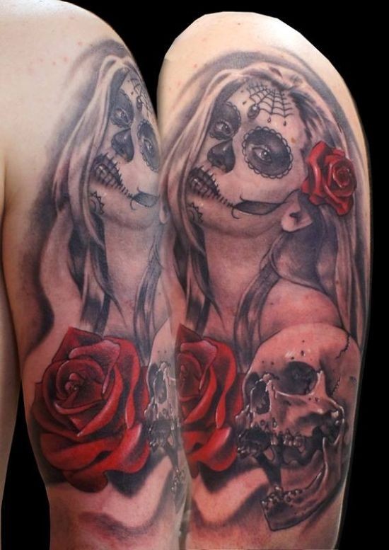 Mexican traditional colored woman portrait with red rose and skull tattoo on shoulder