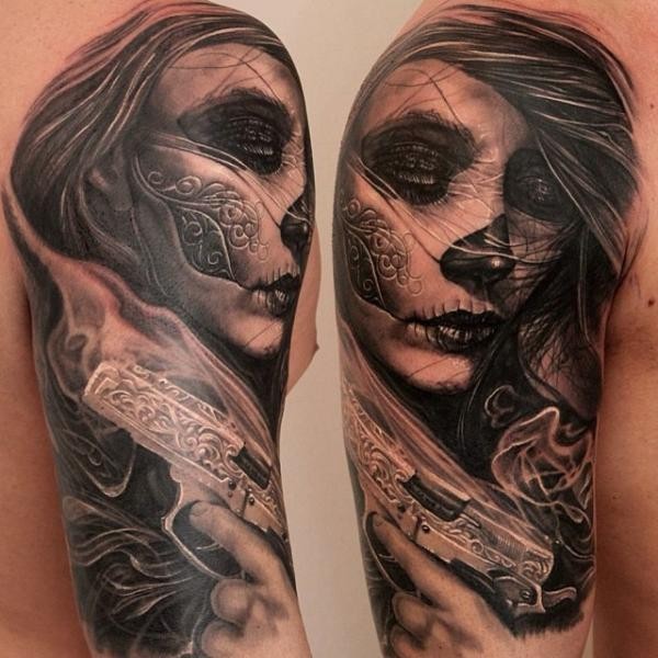 Mexican traditional style black ink shoulder tattoo of woman with pistol