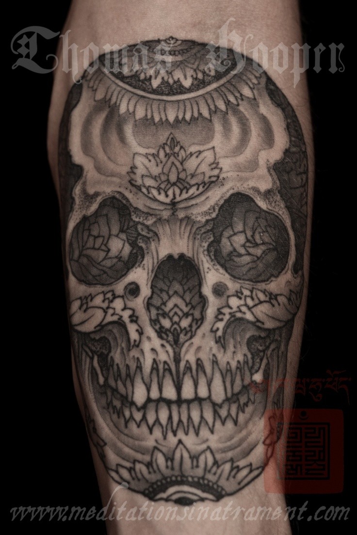 Mexican traditional style colored arm tattoo of human skull with flowers